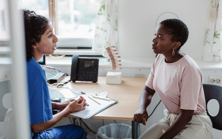 woman talking to doctor