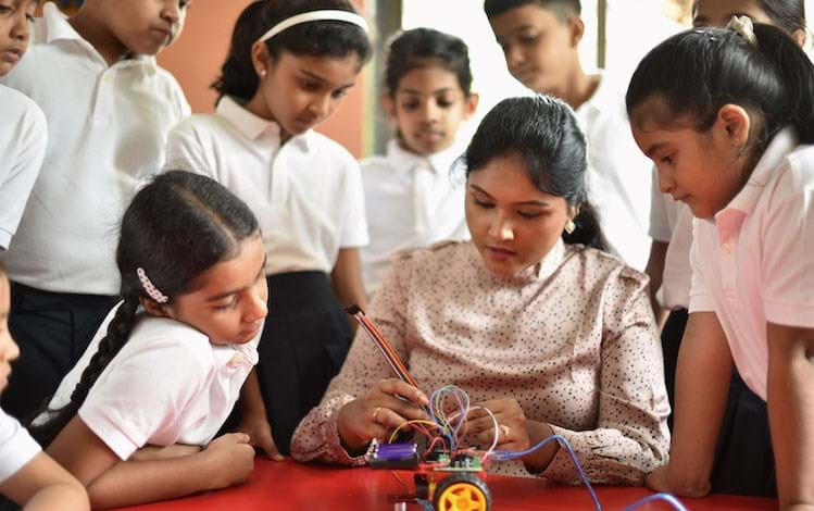 STEM Teacher showing how to build a model