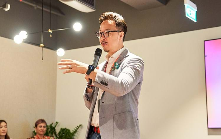 man presenting at a conference