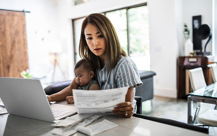 woman working and taking care of baby