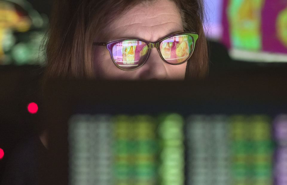 Woman looking at computer with MRI scans